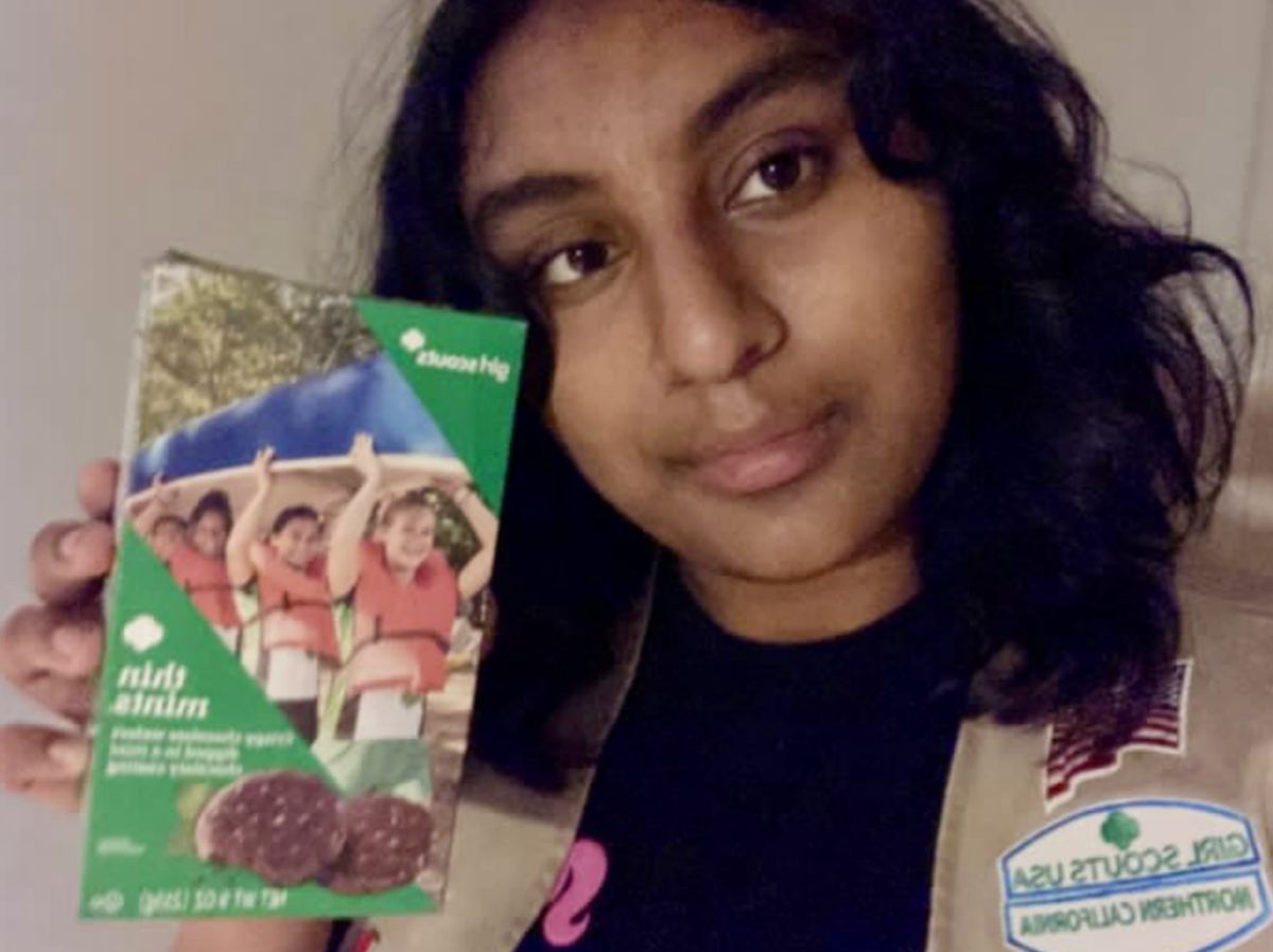 Girl scout Simran Shinkre ‘27 showing girl scout cookies.